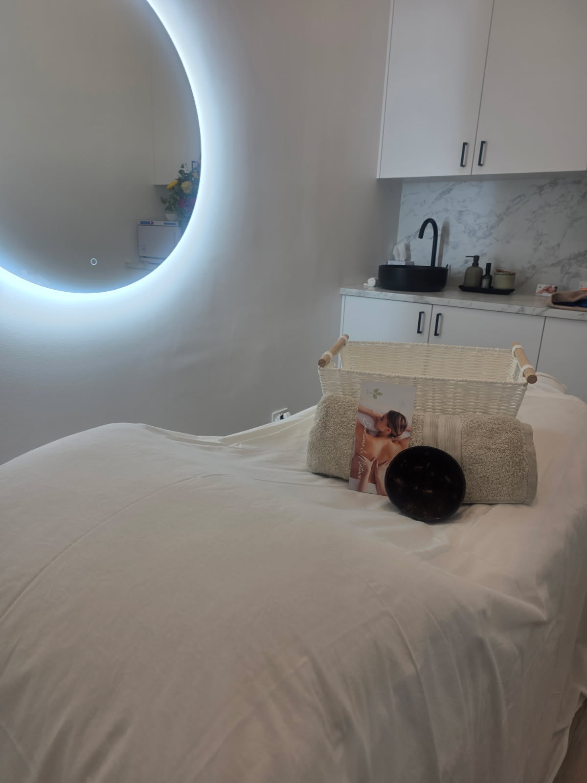 A softly lit treatment room with the studio's signature glow